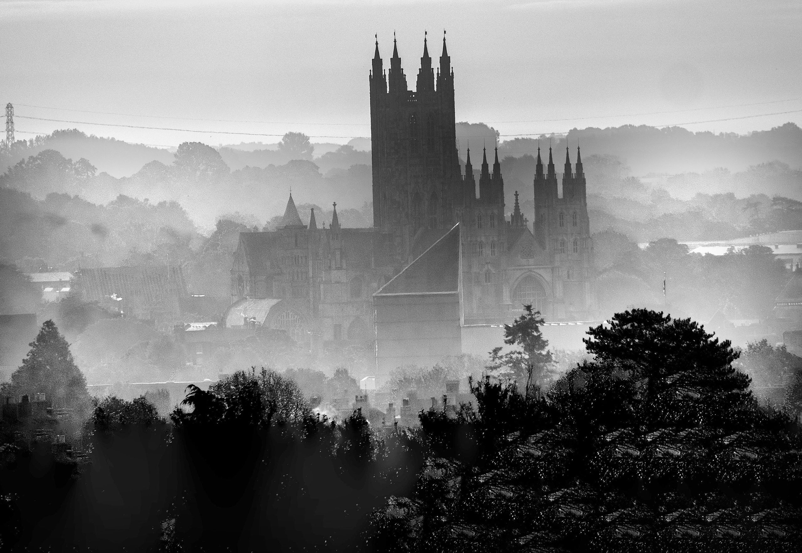 Canterbury Cathereral in mist with woods in background